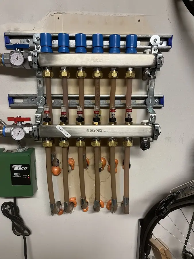 Plumber performing Water Heater Repair at a residential property in Layton